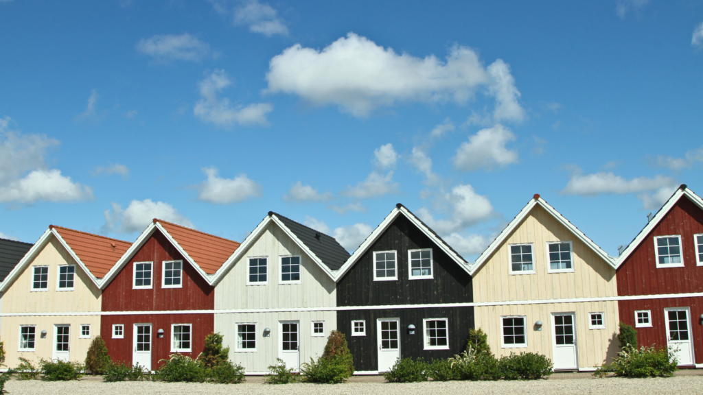 a row of identical swedish style houses of different colours