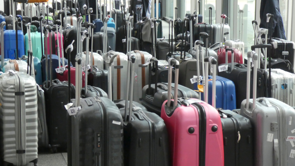 A bunch of suitcases in different colours.