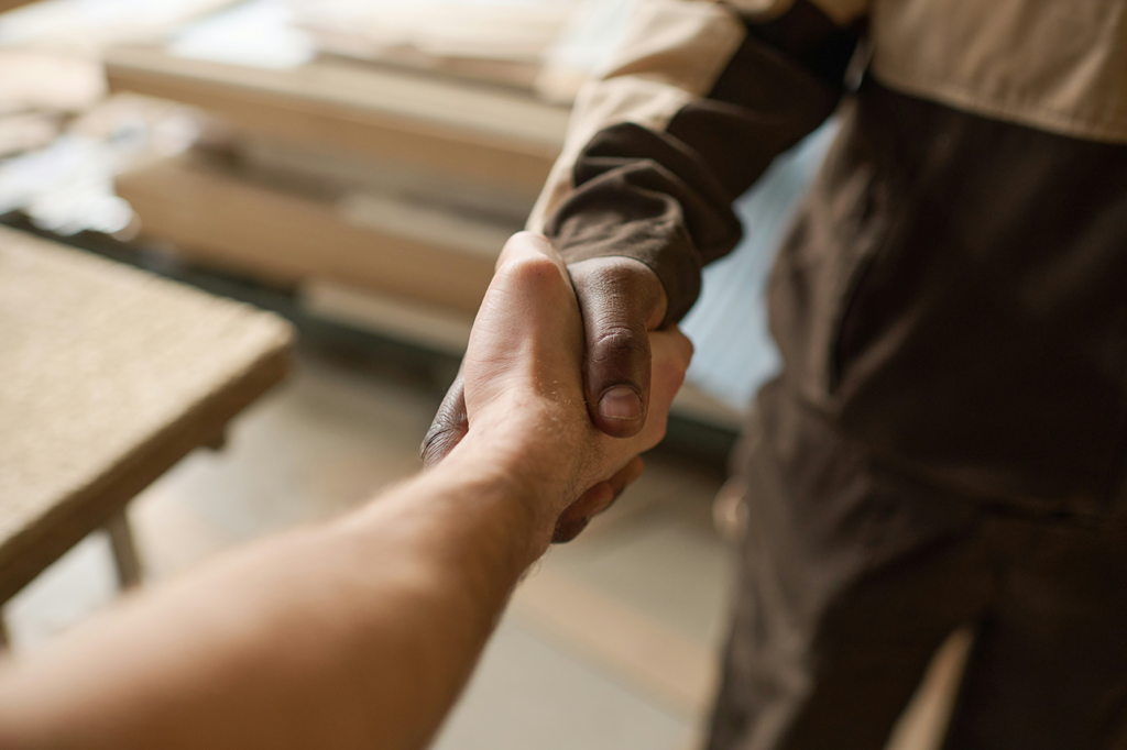 Two people shaking hands.